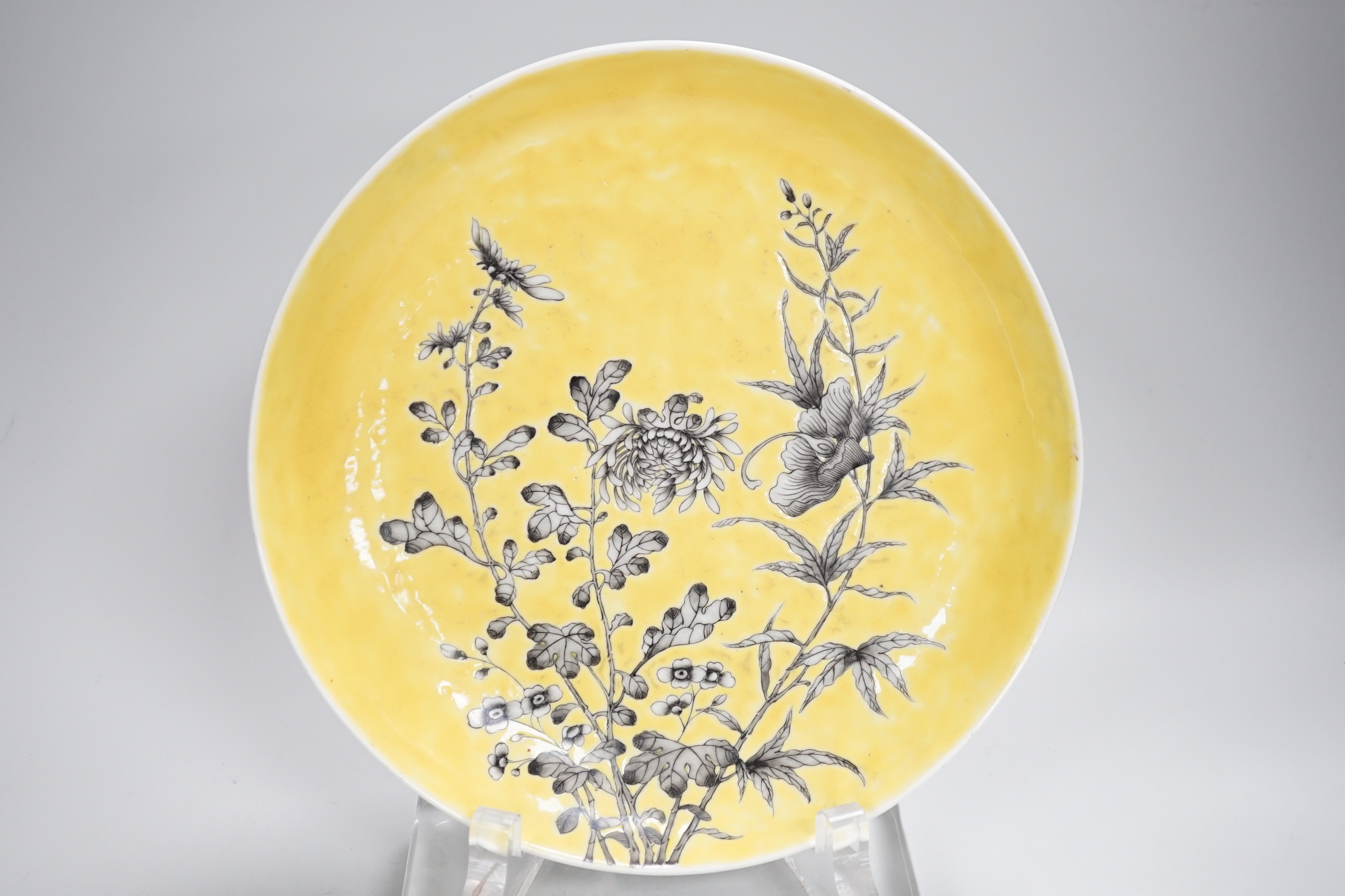A Chinese grisaille enamel yellow ground dish, Guangxu mark and possibly of the period (1875-1908), 24cm in diameter
